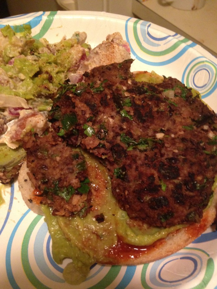 Mexican Black Bean Burger (with vegan potato salad, topped with BBQ sauce and guacamole)