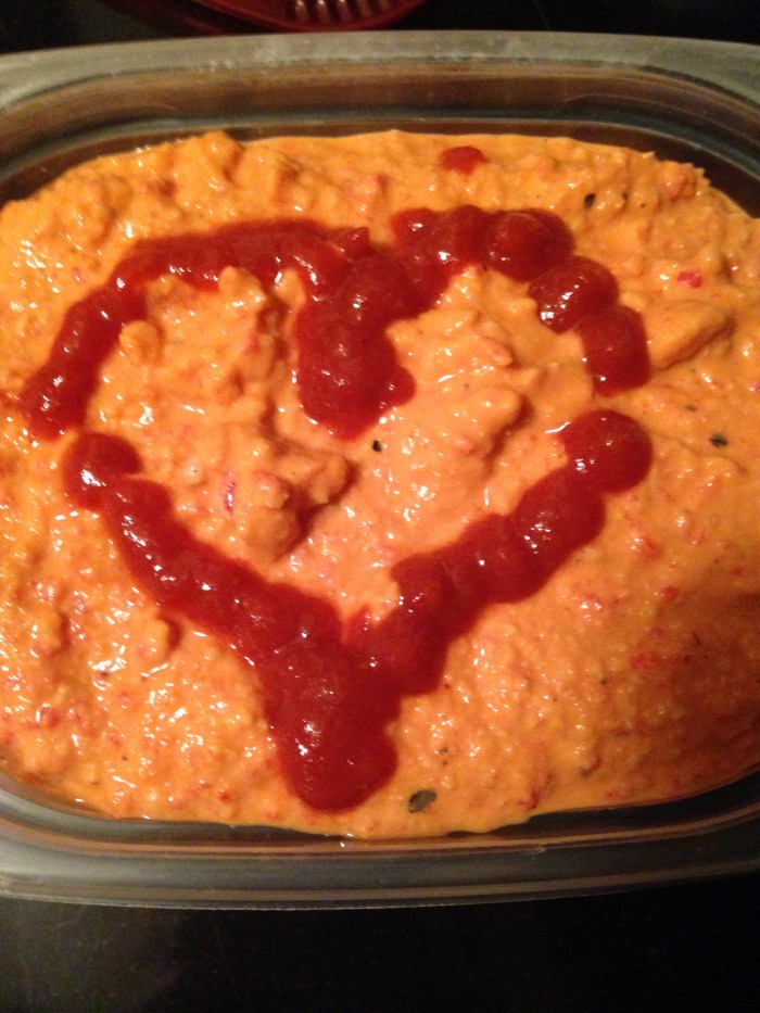 Roasted Red Pepper hummus topped with some Sriracha love.