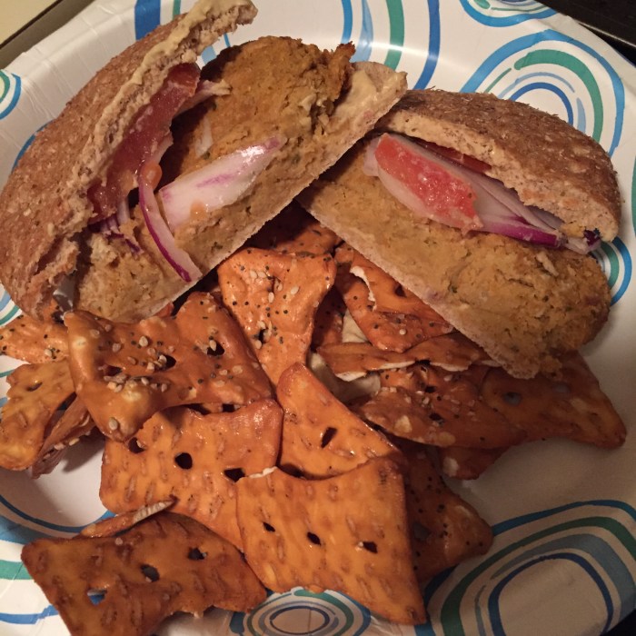 Served on a whole wheat sandwich thin with sliced tomato, onion and hummus. With a side of pretzel thins.