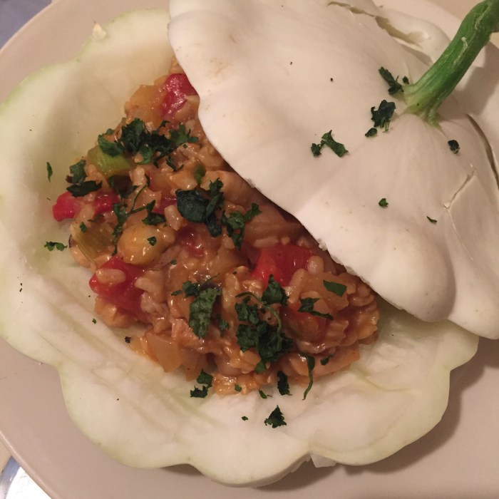 Pattypan squash stuffed with brown rice, straw mushrooms, red pepper, cilantro, garlic, soy sauce, hoisin, ginger and garlic.